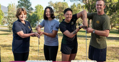 From left, Rear Admiral Letitia Van Stralen, Seaman Deborah Kwon, Private Danielle Collier and Brigadier Jason Groat cut the cakes to celebrate the 124th birthday of Navy and Army.