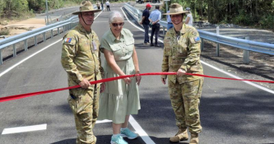 Warrant Officer Class Two Greg Mills, Private Jacinta Watson's mother Genia Otuszewski, and Lieutenant Colonel Rachael Ayoub cut the ribbon to mark the opening of the Private Jacinta Watson Bridge at Greenbank Training Area. Story by Lieutenant Fenlan Miller.