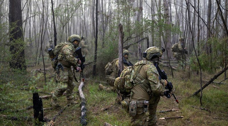Army soldiers from 1st/15th Royal New South Wales Lancers patrol through bush at Holsworthy, NSW, during Exercise Menin Run. Story by Captain Tim Klingner. Photos by Corporal Jarrod Moreels.