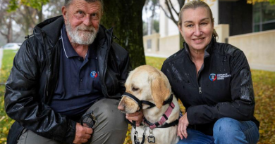 Peter Mengel with his Labrador Peaches and Defence Community Dogs Managing Director Leanne Kyle during a Defence Community Dogs awareness day at Russell Offices, Canberra. Story and photos by Corporal Jacob Joseph.