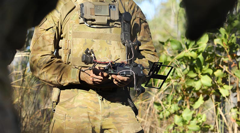 An Australian Army soldier from 1st Armoured Regiment briefs Chief of Army on some of his units new experimental fighting equipment in Shoalwater Bay training area in Queensland during Exercise Talisman Sabre 2025. Photo by Captain Joanne Leca.