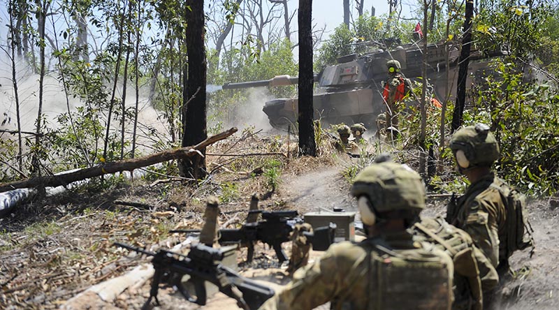 Soldiers from 8th/9th Battalion, Royal Australian Regiment, watch on as an M1A1 Abrams main battle tank fires in support during Exercise Diamond Run 2017. Photo by Captain Anna-Lise Brink.