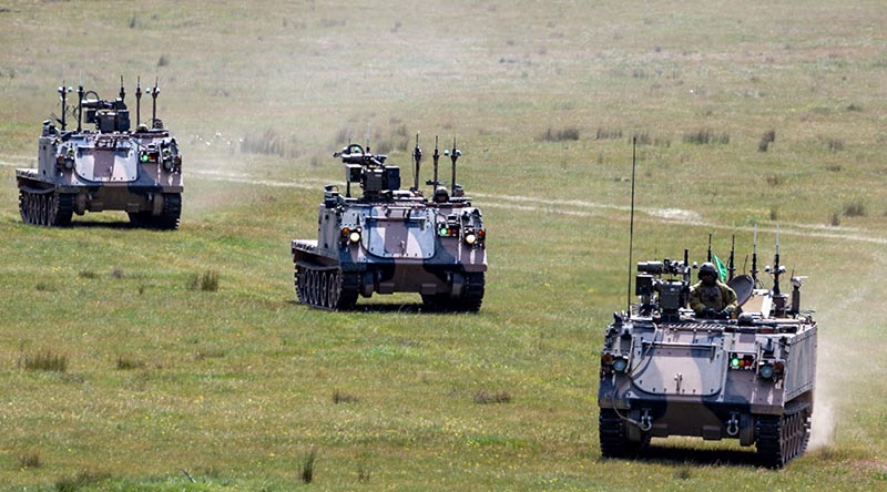 A controller vehicle is followed by two optionally crewed combat vehicles during a land autonomous systems teaming demonstration at Puckapunyal Military Area, September 2024. Photo by Corporal Michael Currie.