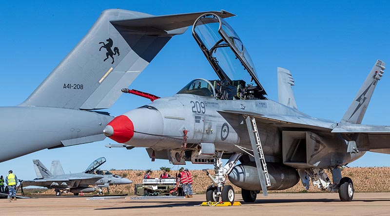 Royal Australian Air Force personnel conduct re-arming operations on an F/A-18F Super Hornet at the Forward Arming and Refuelling Point at RAAF Base Learmonth, Western Australia, during Exercise Talisman Sabre 2025. Photo by Corporal Michael Currie.