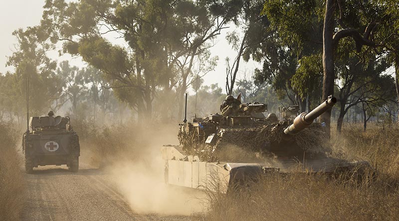 An Australian M1 Abrams main battle tank and an M113 AS4 personnel carrier from 2nd Cavalry Regiment during Exercise Brolga Sprint 24 at Townsville Field Training Area, Queensland. Photo by Trooper Dana Millington.