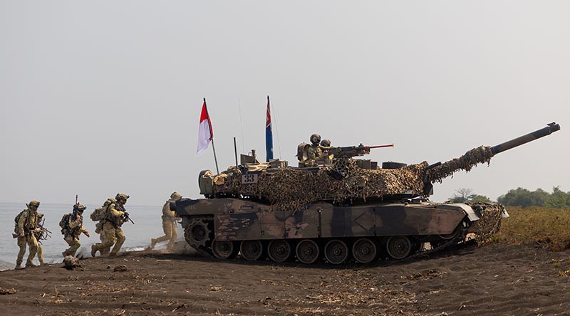 Australian soldiers and an Australian Army M1A1 Abrams conduct an amphibious assault during Exercise Keris Woomera 2024 at Banongan Beach, Indonesia. Photo by Corporal Janet Pan.