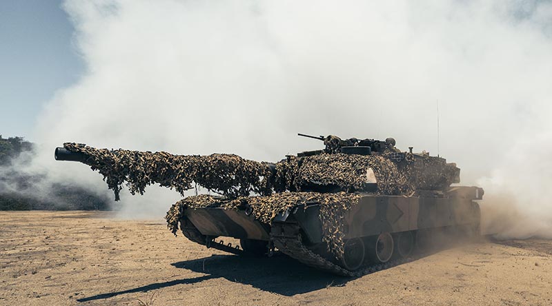 A M1A1 Abrams main battle tank puts out a smokescreen at Cowley Beach, Queensland. Photo by Leading Seaman David Cox.