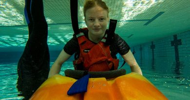 Lieutenant Kiesha Dowsett goes under in a kayak roll drill at Latchford Barracks pool. Story by Captain Krysten Clifton. Photos by Michael Banovic.