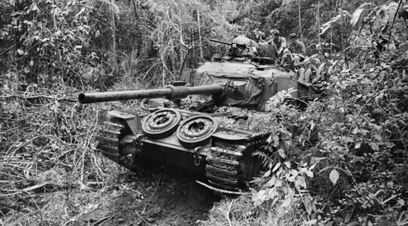 A Centurion tank of C Squadron, 1st Armoured Regiment, moving through the jungle in South Vietnam. June 1971. Australian War Memorial file FOD/71/0305/VN.