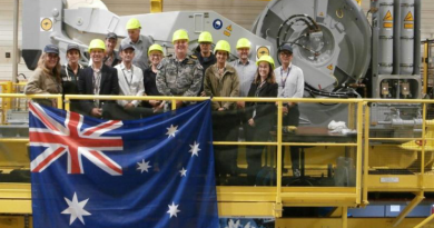 Royal Australian Navy officer Commander Roy Casson, centre, and the team at the Thales Defence Mission Systems facility in Brest, France. Story by Midshipman Thomas Norman.