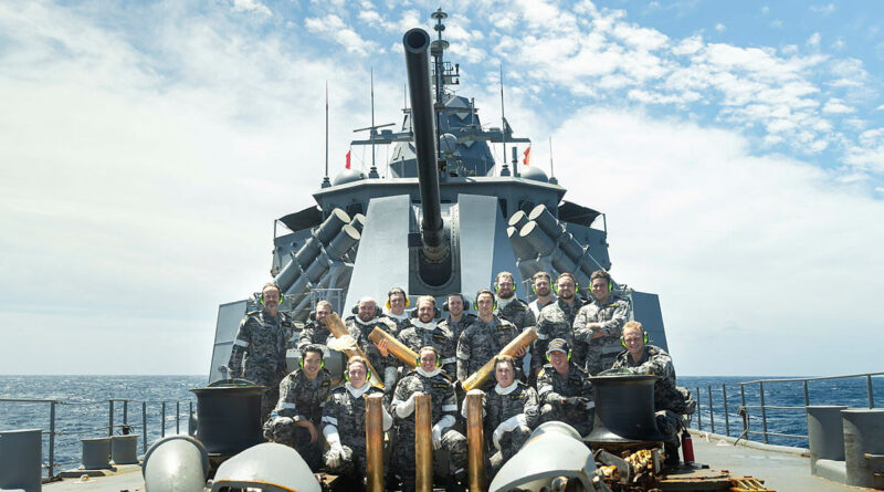 HMAS Warramunga's weapons electrical team after a successful 5-inch live-fire exercise during a regional presence deployment. Photo by Leading Seaman Abdus Chowdhury.