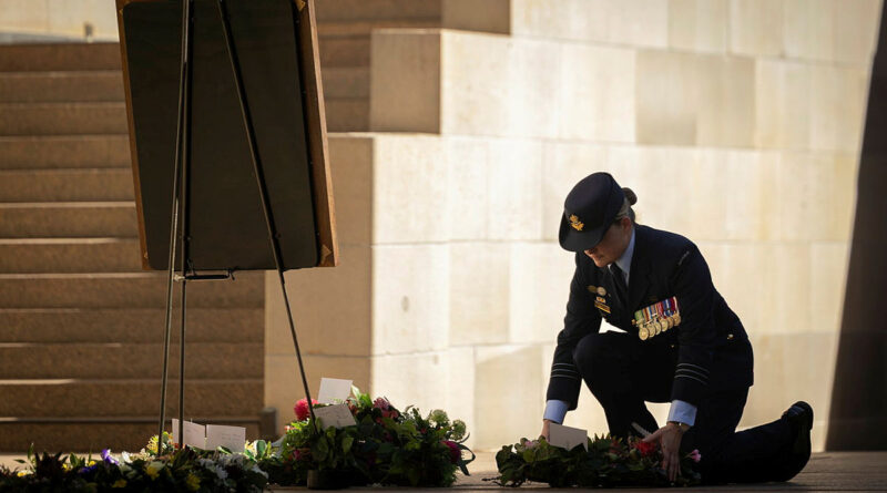 Commanding Officer 460 Squadron Wing Commander Karri Roberts lays a wreath for the late RAAF World War II veteran, Flying Officer Peter Birt, during a Last Post ceremony at the Australian War Memorial, Canberra. Story by Flying Officer Michael Thomas. Photos by Leading Aircraftman Kurt Lewis.