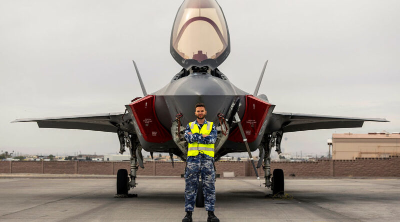 Royal Australian Air Force Aircraft Technician, Leading Aircraftman Rory Kerr, stands in front of an F-35A Lightning II aircraft during Exercise Red Flag 26-1 at Nellis Air Force Base, United States. Story by Squadron Leader Tina Turner. Photos by Leading Aircraftwoman Nell Bradbury.