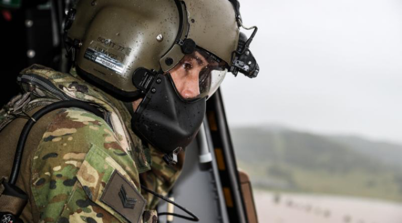 Then a sergeant, Warrant Officer Class 2 Rick Scott surveys flood waters in Lismore, New South Wales, from an MRH 90 Taipan helicopter during Operation Flood Assist 2022. Story by Corporal Michael Rogers. Photo by Bradley Richardson.