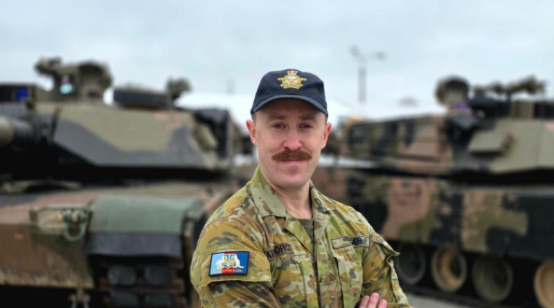 Squadron Leader Chris Dilger in Poland. Story by Lieutenant Commander John A. Thompson. Photo by Lieutenant Commander J. A. Thompson.