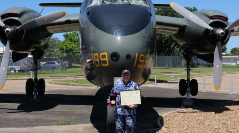 Sergeant David Humphry with his Certificate of Service and gold Air Force service medallion at RAAF Base Townsville, Queensland. Story by Flight Lieutenant Natasha Silver.