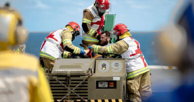 HMAS Canberra personnel attend to a simulated casualty during a crash-on-deck exercise while transiting off the coast of Queensland ahead of Exercise Sea Wader. Story by Captain Karam Louli. Photo by Able Seaman Jaxsen Shinners.