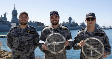 From left, Able Seaman Adam Brazier, Leading Seaman Sam Lomax and Seaman Patrick Ward hold Australian-made seawater strainers. Story by Captain Annie Richardson. Photos by Leading Aircraftman Thomas Clarke-Kelly.
