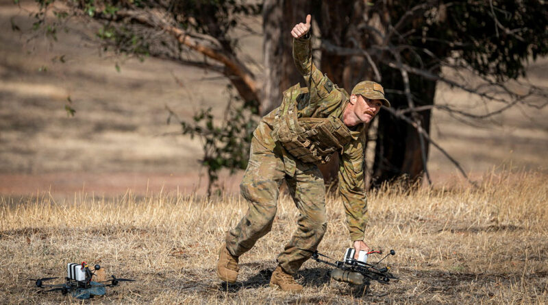 An Australian Army soldier signals 'all clear' to launch a drone using first-person-view goggles during the Modify and Operate Attack Drone (FPV) course at Puckapunyal Military Area, Victoria. Story by Major Martin Hadley. Photos by Sergeant Nicole Dorrett.