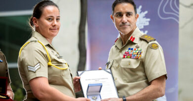 Chief of Army Lieutenant General Simon Stuart awards recipient Corporal Sarah Vella the Jonathan Church Good Soldiering Award during Army's 125th birthday event at Russell Offices, Canberra. Story and photo by Leading Aircraftman Chris Tsakisiris.