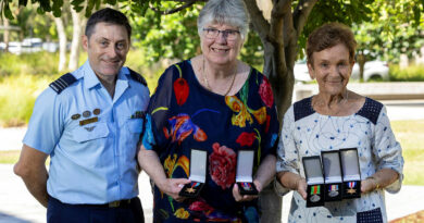 From left, Wing Commander Peter Croce, Anne Burton and Margaret Hilton with the medals awarded to the late Warrant Officer William Kinloch. Photos by Leading Aircraftwoman Nell Bradbury.