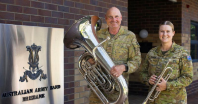 Lance Corporal Imogen Barker and her father, Musician Bill Barker, prepare with the combined military bands of the ADF for their performance with the Royal Edinburgh Military Tattoo in Brisbane. Story by Story and photo by Corporal Julia Whitwell.