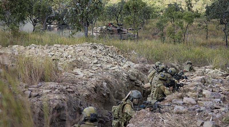 Australian Army soldiers from the 1st Battalion, Royal Australian Regiment, conduct a trench clearance supported by Abrams main battle tanks from 2nd Cavalry Regiment, as part of Exercise Brolga Sprint at Townsville Field Training Area, Queensland. Photo by Private Jessica Gray.