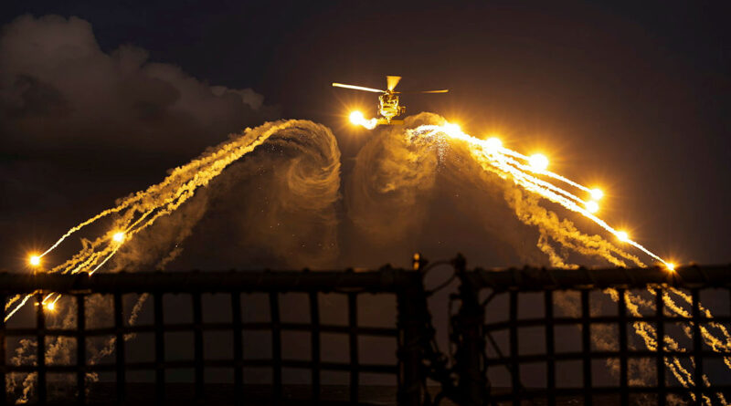 HMAS Warramunga’s embarked MH-60R launches decoy flares during a flying exercise at sea. Story by Sub-Lieutenant Keigan Gunther. Photos by Leading Seaman Abdus Chowdhury.