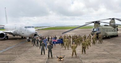 ADF personnel from 12 Squadron and 5th Aviation Regiment stand for a group photo during the historical call sign handover ceremony at RAAF Base Townsville. Story by Flight Lieutenant Holly Ryan. Photos by Leading Aircraftwoman Halley Van essen.