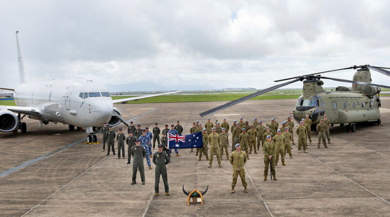 ADF personnel from 12 Squadron and 5th Aviation Regiment stand for a group photo during the historical call sign handover ceremony at RAAF Base Townsville. Story by Flight Lieutenant Holly Ryan. Photos by Leading Aircraftwoman Halley Van essen.