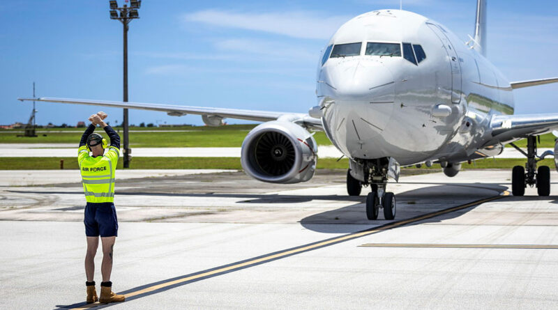 A member of the maintenance crew directs a RAAF P-8A Poseidon post-flight on the apron, at United States Air Force Andersen Air Base, Guam, during Exercise Sea Dragon. Story by Flight Lieutenant Jody Blakeley. Photo by Aircraftman Jakob Reid.