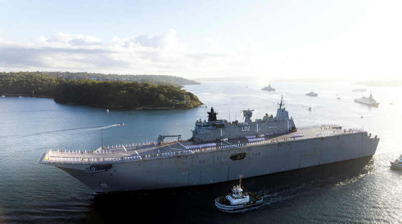The ship's company of HMAS Canberra lines the upper decks, followed by JS Kumano, FNS Auguste Benebig, HMAS Brisbane and Guardian-class Patrol Boat HMPNGS Francis Agwi as they sail past Bradley's Head for the Exercise Kakadu Fleet Review. Story by Sub-Lieutenant Jonathan Rendell. Photo by Leading Seaman Susan Mossop.