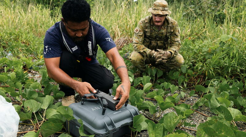 Australian Army soldier Corporal Justin MacLennan watches Steve Nasui, of the Solomon Islands National Disaster Management Organisation, deploy a drone as part of Exercise Coastwatchers in the Solomon Islands. Story by Major Diana Jennings. Photos by Corporal Riley Blennerhassett.