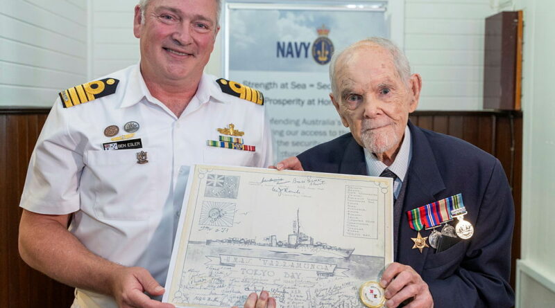 Commanding Officer HMAS Cerberus Captain Ben Esler presents Navy veteran Ron Stannus with a copy of a drawing of HMAS Warramunga, at the Heritage and Learning Centre, HMAS Cerberus, Victoria. Sub-Lieutenant Andrew Murphy. Photos by Petty Officer Bradley Darvill.