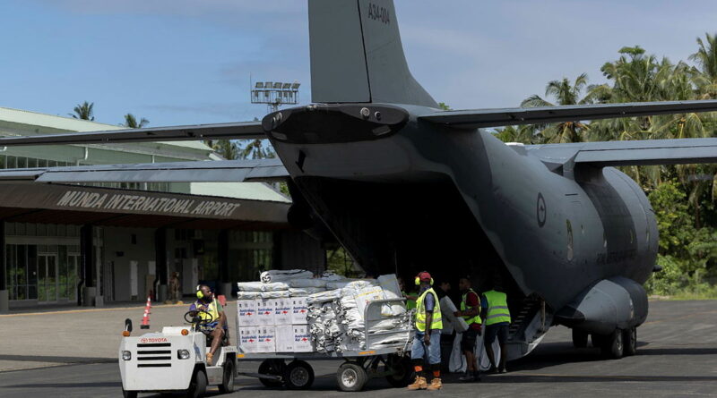 Solomon Islands airport staff unload Australian aid from a 35 Squadron C-27J Spartan at Munda International Airport following Tropical Cyclone Maila. Story by Flight Sergeant Mark Eaton. Photos by Leading Aircraftwoman Maddison Scott.