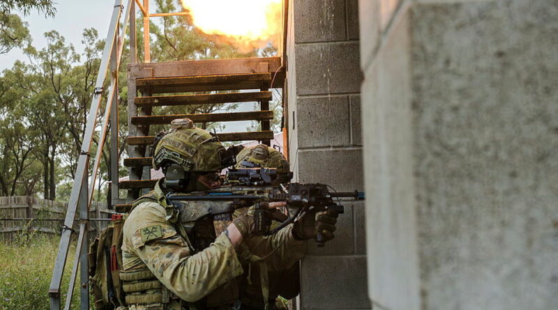 Soldiers from the 1st Battalion, Royal Australian Regiment, and 3rd Combat Engineer Regiment explosively breach a doorway during the Basic Assault Pioneers Course.Story by Captain Andrew Page. Photo by Lance Corporal Andrews.