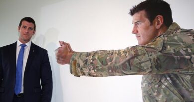 Benjamin Roberts-Smith, VC, MG, stands next to the larger of two official portraits by renowned artist Michael Zavros unveiled at the Australian War Memorial on 2 September 2014. Photo by WO2 Andrew Hetherington.