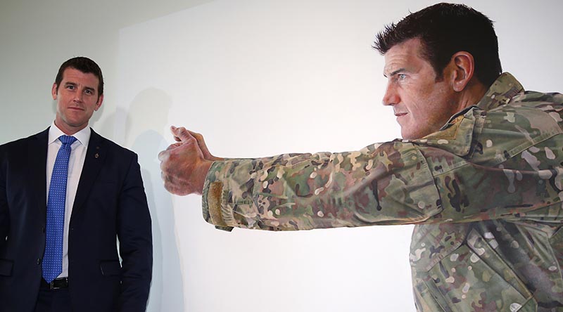 Benjamin Roberts-Smith, VC, MG, stands next to the larger of two official portraits by renowned artist Michael Zavros unveiled at the Australian War Memorial on 2 September 2014. Photo by WO2 Andrew Hetherington.