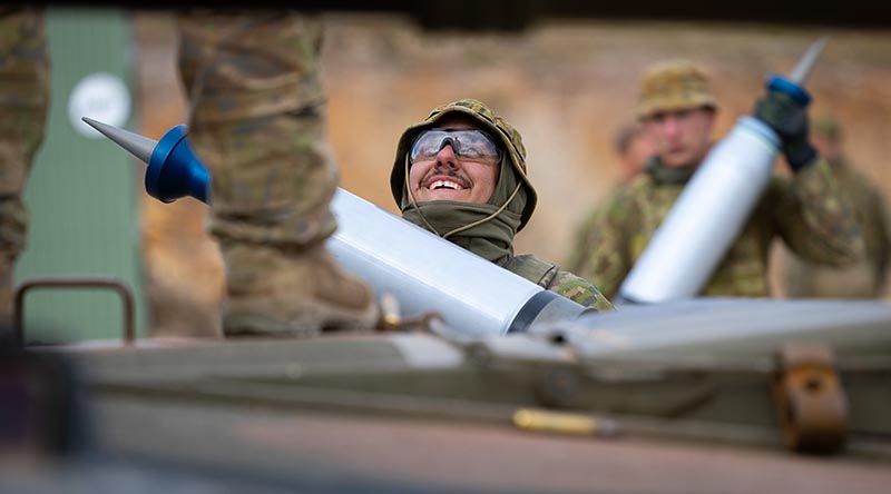 Australian Army soldiers load ammunition onto an M1A1 Abrams main battle tank during the Coral Balmoral Cup 2024 at Puckapunyal, Victoria. Photo by Corporal Johnny Huang.