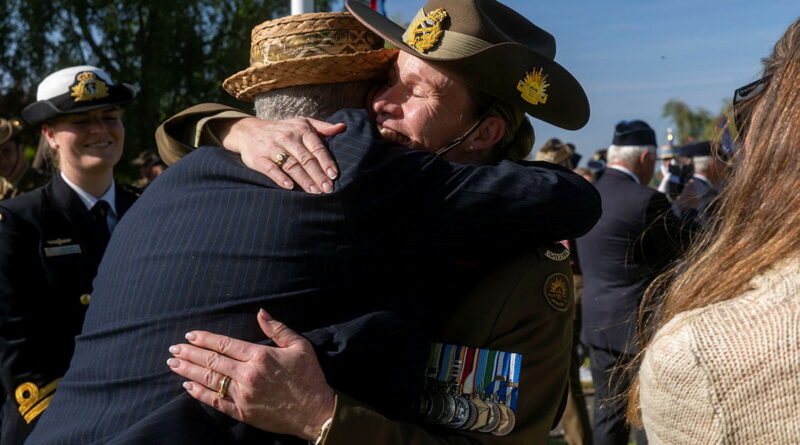 Chief of Joint Capabilities Lieutenant General Susan Coyle hugs Rick Deeks during the Anzac Day service at the Bullecourt Digger Memorial in France. Story by Captain Annie Richardson. Photos by Sergeant Jarrod McAneney.