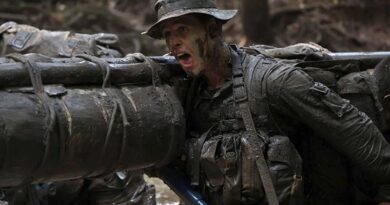 Lieutenant Guy Campbell, 1RAR, pushes through a gruelling stretcher carry at the French Foreign Legion's Jaguar Course in French Guiana. Photo supplied.