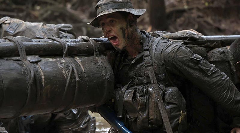 Lieutenant Guy Campbell, 1RAR, pushes through a gruelling stretcher carry at the French Foreign Legion's Jaguar Course in French Guiana. Photo supplied.