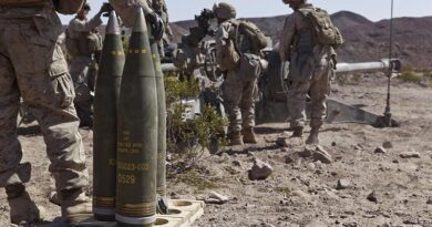 Marines from the 3rd Battalion, 12th Marine Regiment, stand ready to load M795 high explosive rounds into an M777 lightweight 155mm howitzer during a live-fire exercise in California. US Marine Corps photo by Lance Corporal Sean Searfus, 1st Marine Division.