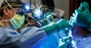 Army general surgeon Major Joseph Dawson, left, and orthopaedic surgeon Major Jarrad Stevens perform minor surgery on a member of Operation Render Safe in Papua New Guinea. Story by Captain Annie Richardson. Photos by Sergeant Andrew Sleeman.