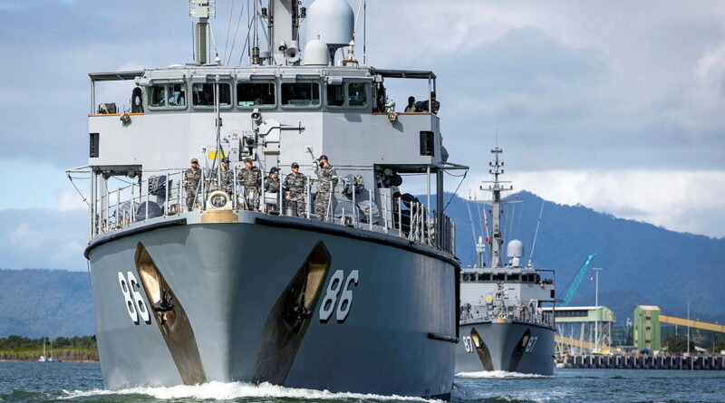 HMAS Diamantina sails ahead of HMAS Yarra as the ships depart Cairns during Operation Render Safe. Story and photo by Captain Jacob Joseph.