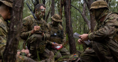 Private Michael Staszak, centre-left, receives orders from his platoon commander before a patrol as part of Exercise Menin Blade at Singleton Military Area, NSW. Story and photo by Corporal Michael Rogers.