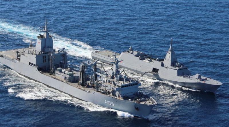 HMAS Supply, foreground, and JS Kumano conduct a replenishment at sea during Anti-Submarine Warfare Exercise. Story by Lieutenant Natalie Starkoff. Photo by Lieutenant Fred Bates.
