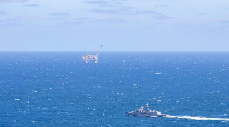 HMAS Toowoomba sails past an offshore oil platform in the Indian Ocean, off the coast of Western Australia. Story by Lieutenant Marcus Middleton. Photo by Leading Seaman Dominic Turkalj.