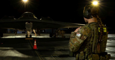 RAAF Leading Aircraftwoman Meilena Frolova patrols a US Air Force B-2 Spirit stealth bomber at RAAF Base Amberley, Queensland. Story by Wing Commander Pete Croce. Photo by Leading Aircraftwoman Aiesha White-Kratz.