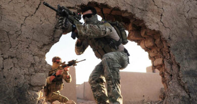 Special Operations Task Group (SOTG) members enter a training compound at Multi National Base Tarin Kowt (MNBTK). Photo by Corporal Chris Moore.
